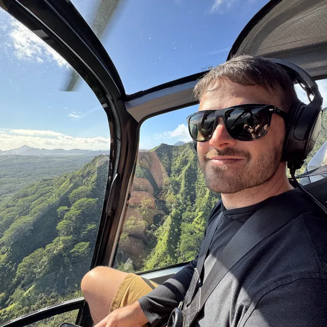 Jeff in a helicopter over the ridges of Kauai
