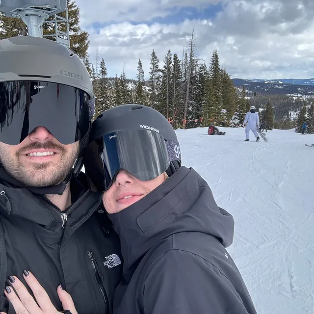 Jeff and Mo in helmets and goggles at the top of a run
